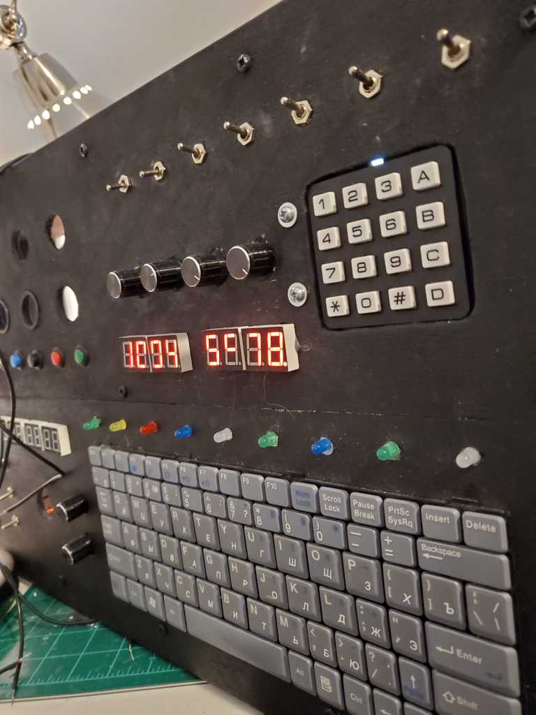 The front of the space station with several of the seven segment displays lit.