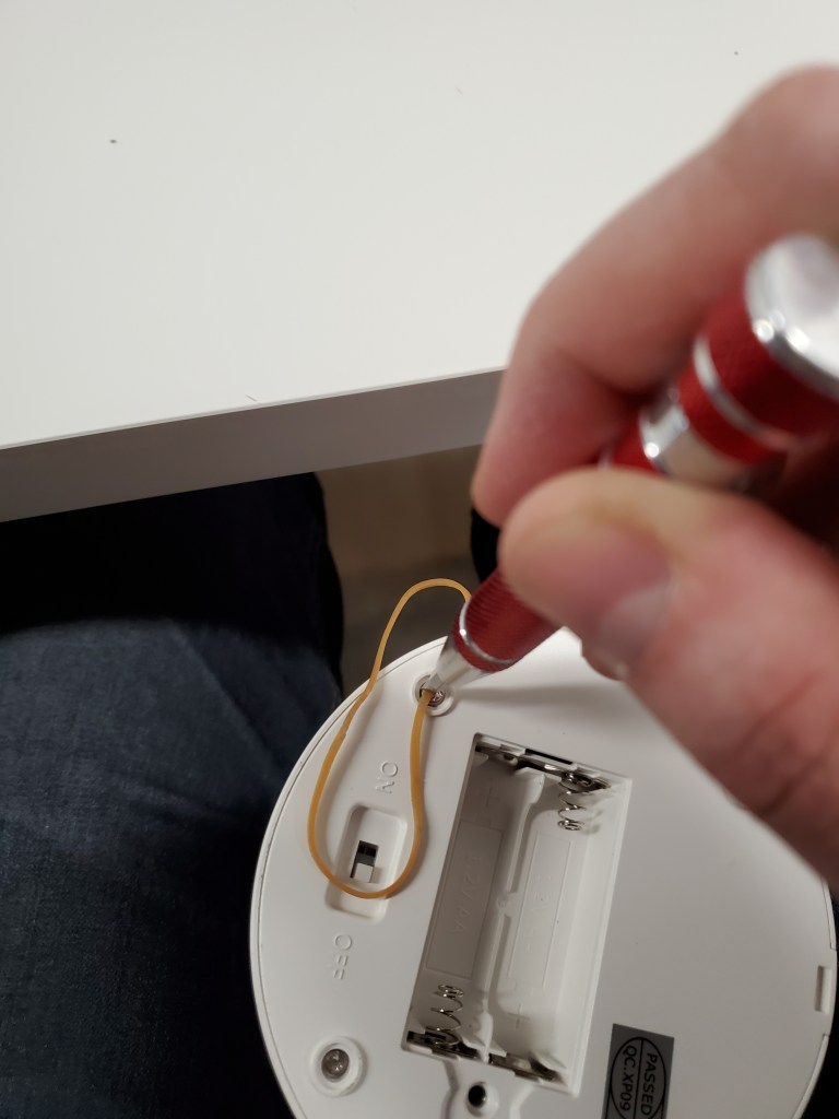 Unscrewing the one way screws by putting a rubberband over the screw head.