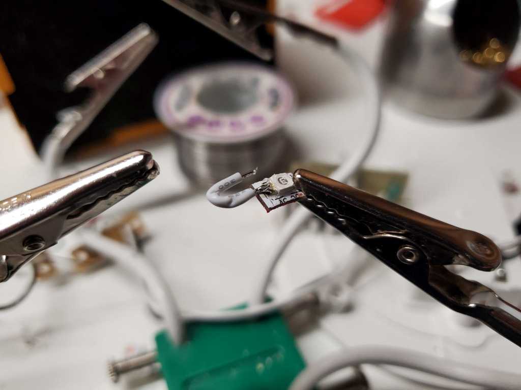 Soldering tiny wires onto the UV LEDs