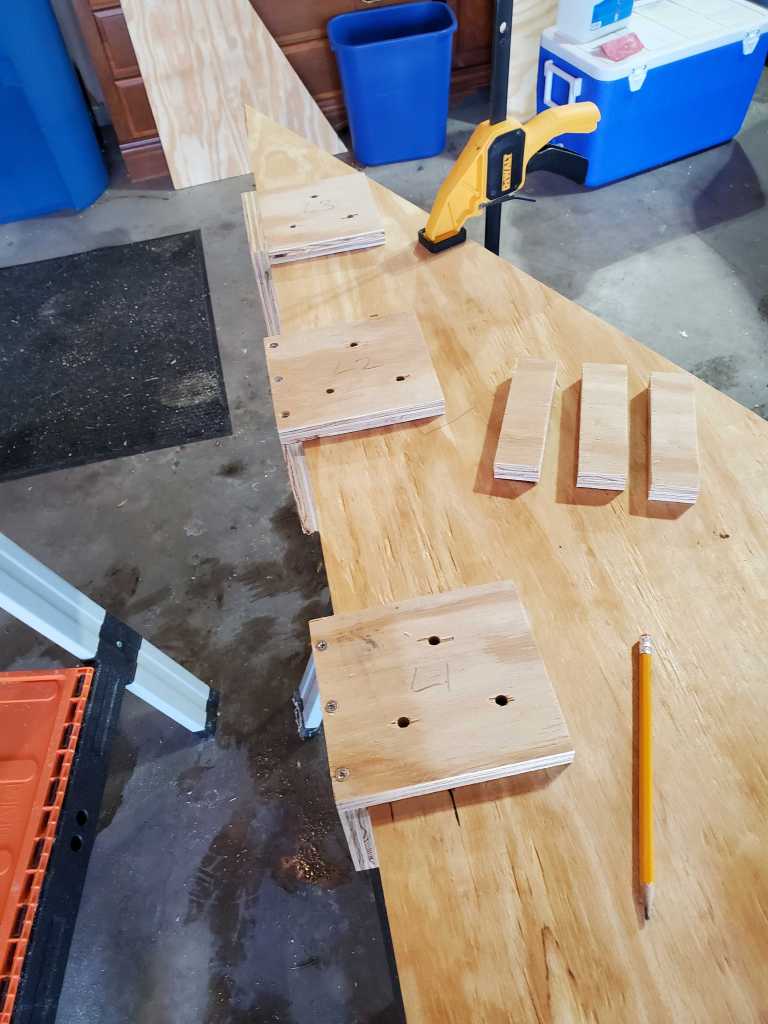 3 brackets arranged on the wooden triangle