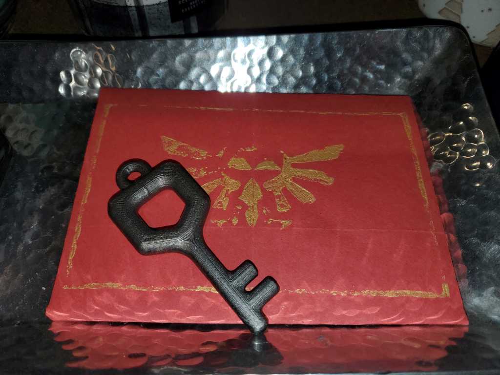 A small key. It can open a locked door in a Zelda dungeon. 