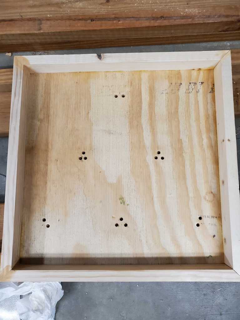 Holes drilled in the display box for the Triforce. 