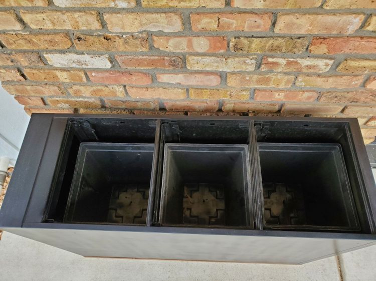 Plastic pots placed into the cabinet.